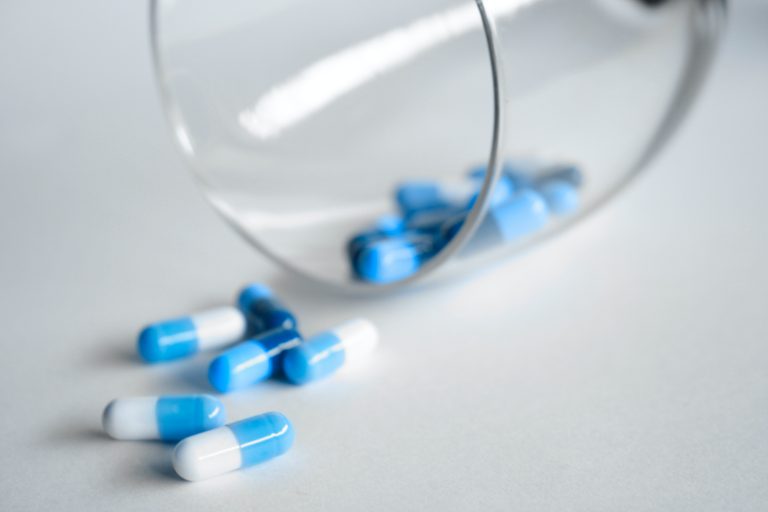 Blue and white pill capsules.